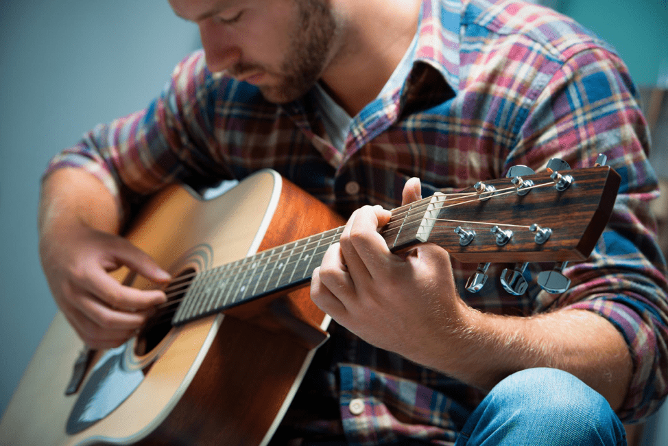 Acoustic Guitar Lessons Master the Art in NYC Now 12 Why Does It Feel So Good to Play Guitar? - Adirondack Guitar
