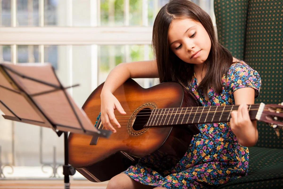 Essential Guide to Buy First Acoustic Guitar NYC 10 11 Benefits of Children Learning the Guitar: Strumming Their Way to Success — Conservatoire de musique de la Monteregie